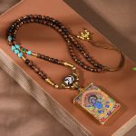Unlock Abundance & Divine Protection: Tibetan Yellow Jambhala Dzi Thangka Pendant